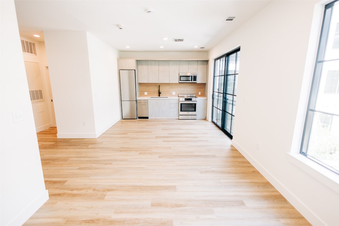 4315 South Congress Avenue, Unit 308 Austin, TX 78745 - Photo 10 of 20 a view of a kitchen with wooden floor