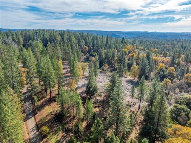a view of a lake with top of house