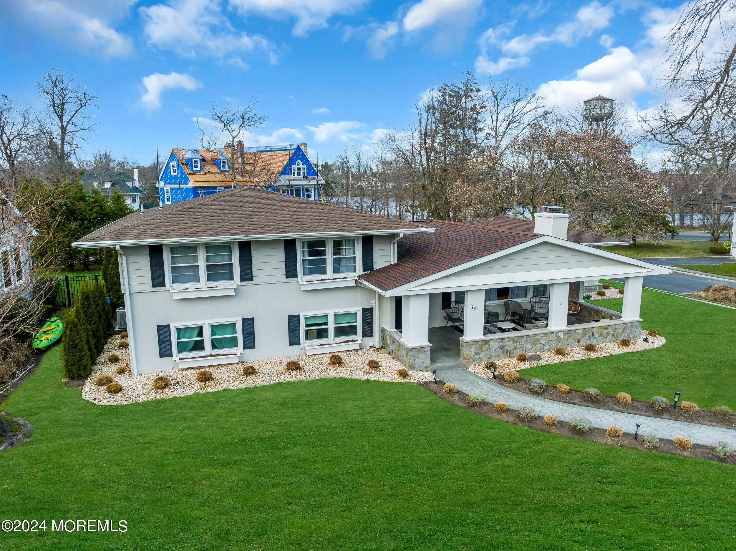 201 Buttermere Avenue Interlaken, NJ 07712 - Photo 1 of 39 a front view of a house with a garden