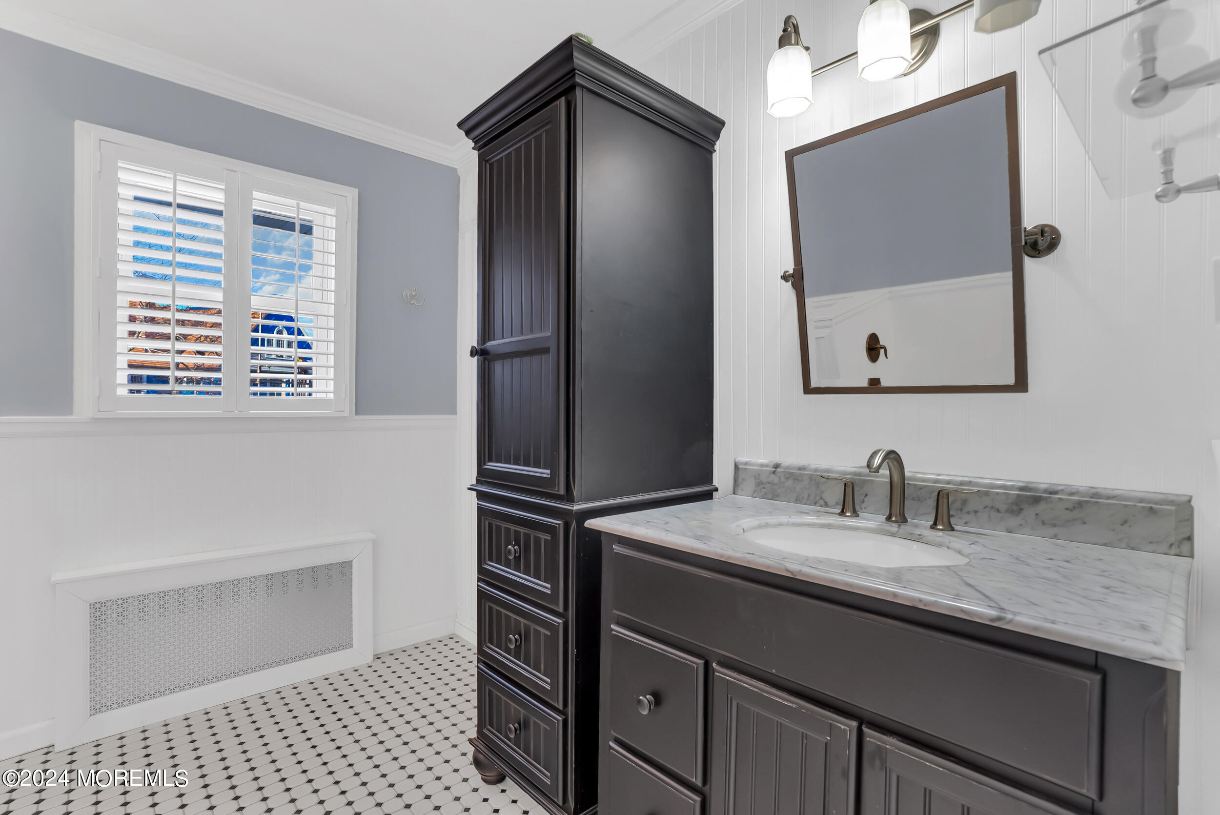 201 Buttermere Avenue Interlaken, NJ 07712 - Photo 24 of 39 a bathroom with a sink a vanity and a mirror