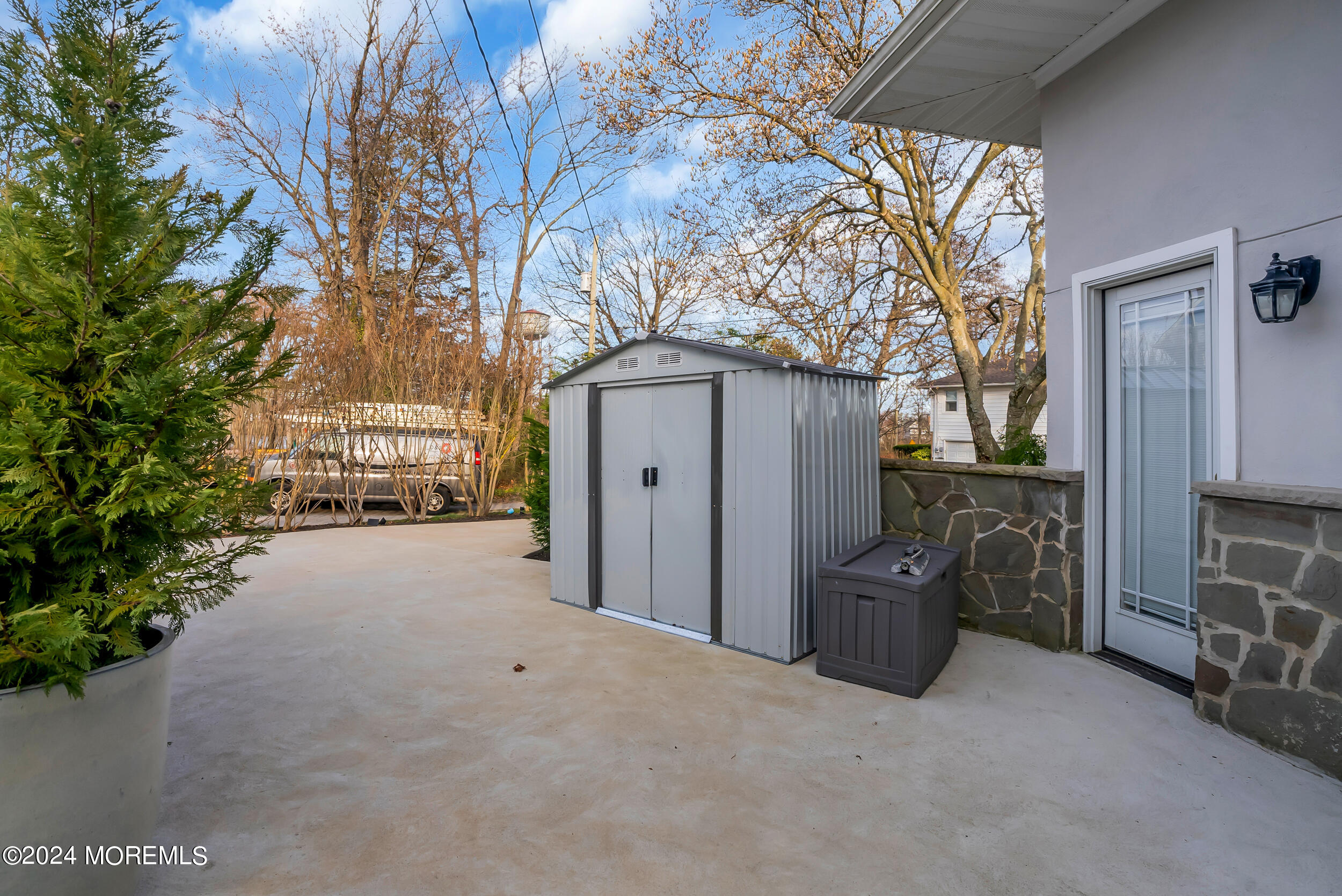 201 Buttermere Avenue Interlaken, NJ 07712 - Photo 27 of 39 a view of a house with a yard and garage