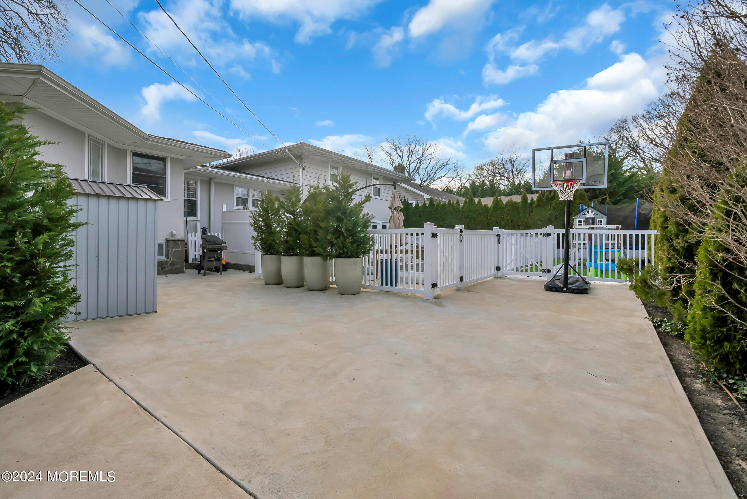 201 Buttermere Avenue Interlaken, NJ 07712 - Photo 30 of 39 a view of a house with backyard and a large tree