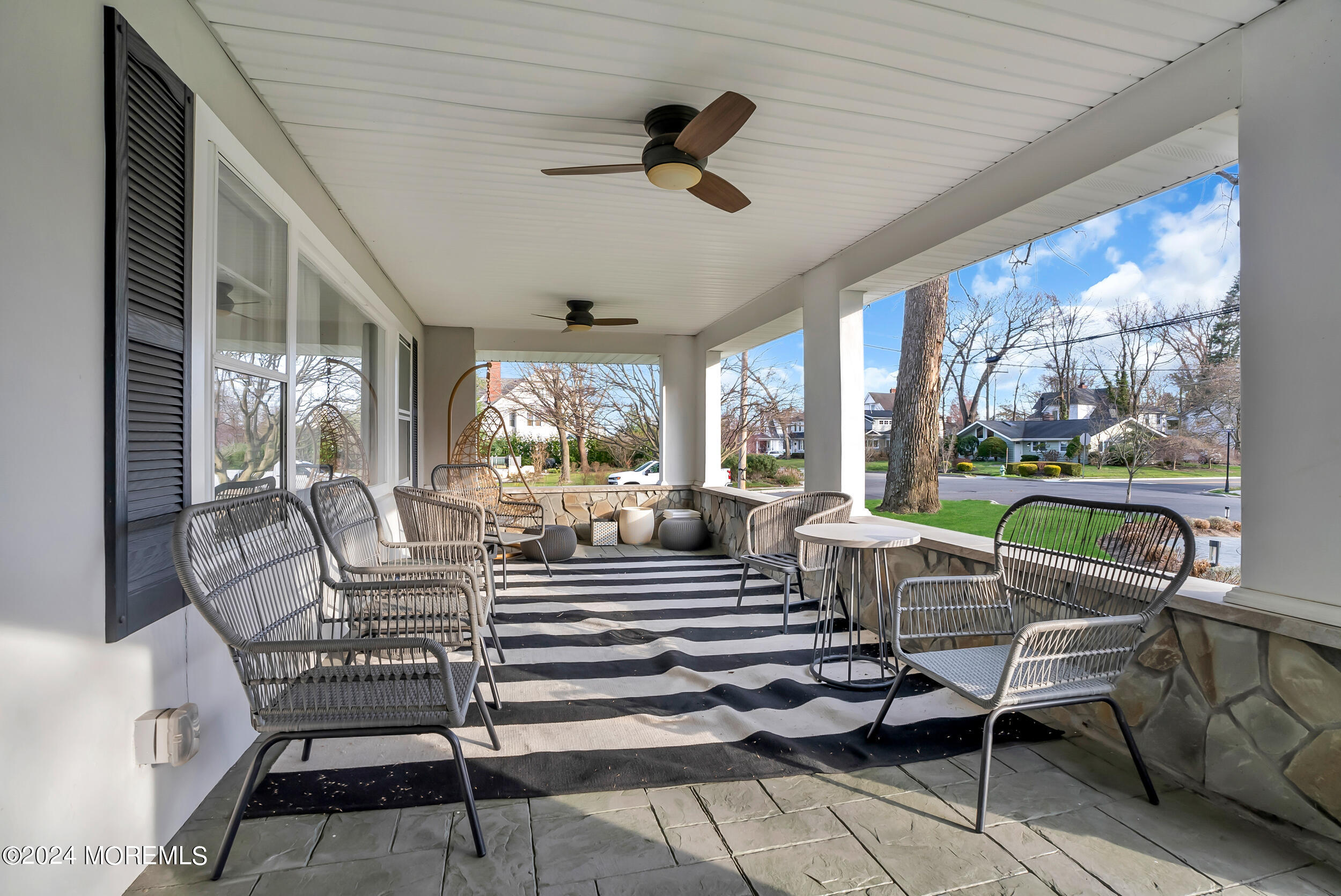201 Buttermere Avenue Interlaken, NJ 07712 - Photo 3 of 39 a living room with patio furniture and a floor to ceiling window