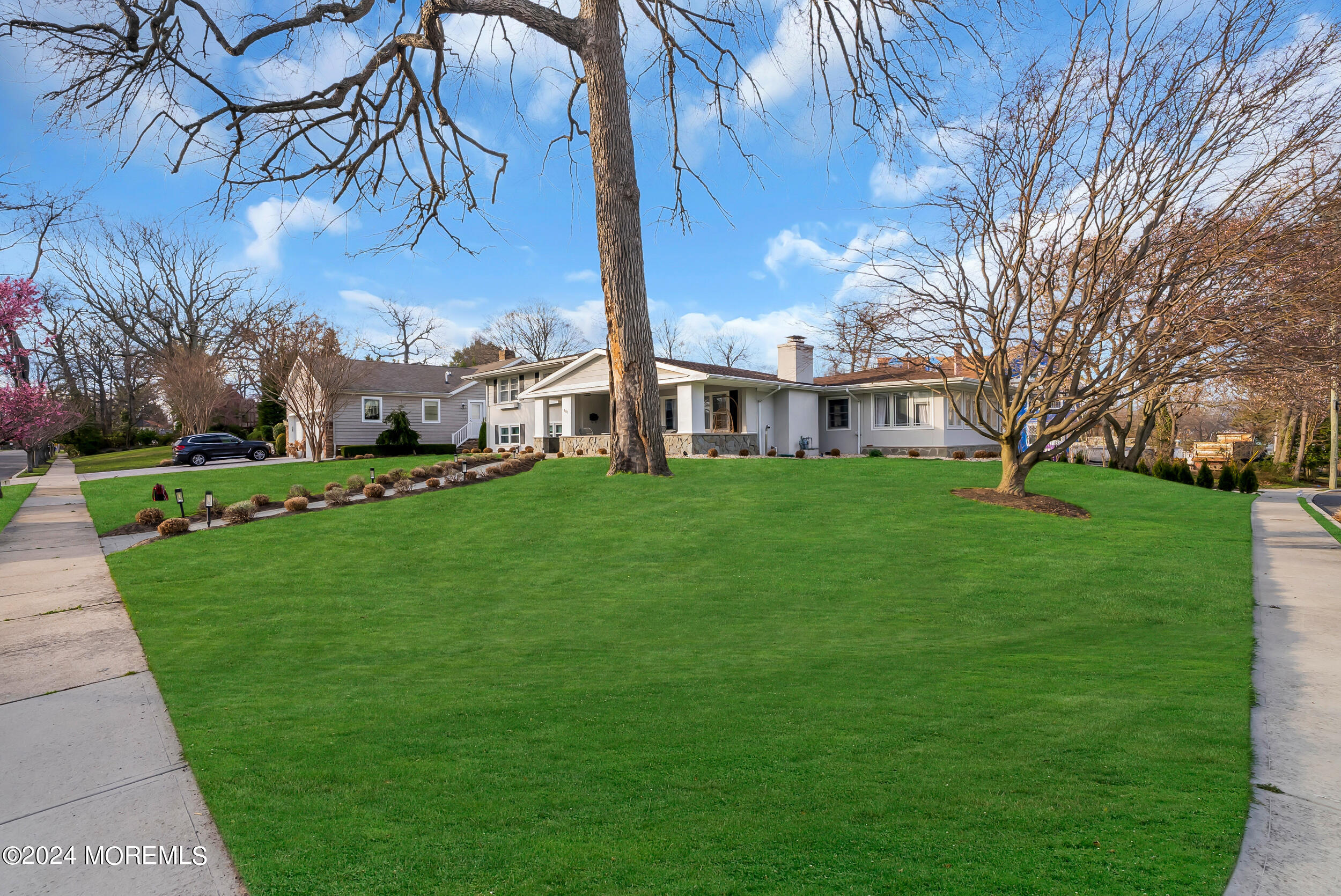 201 Buttermere Avenue Interlaken, NJ 07712 - Photo 31 of 39 a view of a house with a big yard