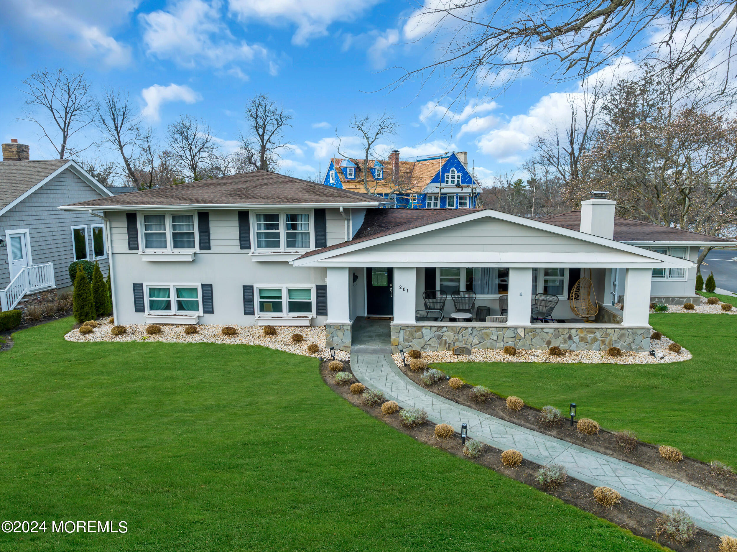 201 Buttermere Avenue Interlaken, NJ 07712 - Photo 39 of 39 a front view of a house with garden