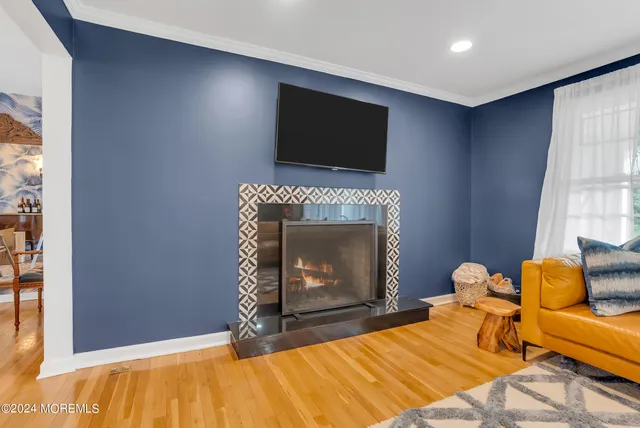 a bedroom with a bed and a television