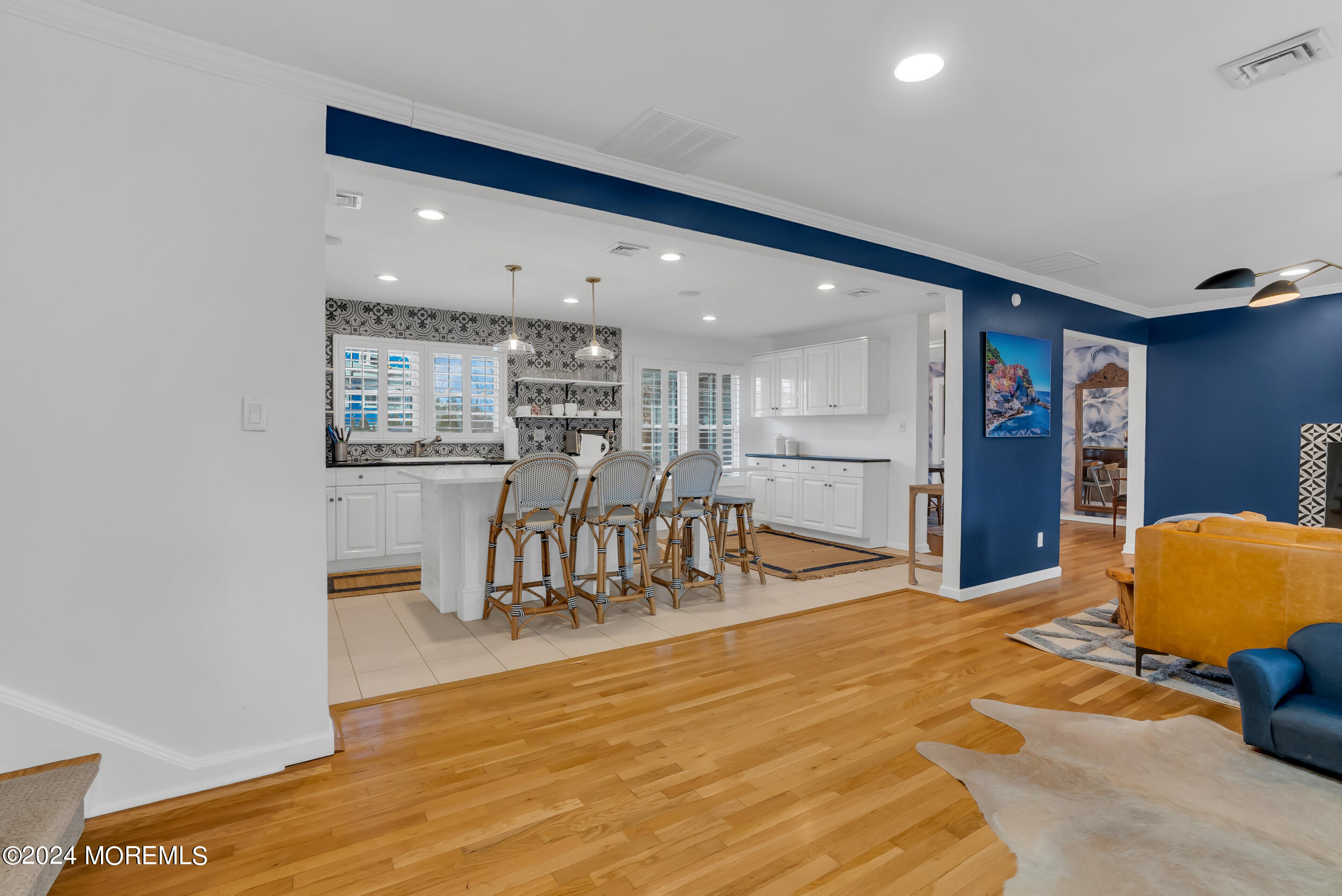 201 Buttermere Avenue Interlaken, NJ 07712 - Photo 7 of 39 a living room with stainless steel appliances kitchen island granite countertop furniture and a kitchen view