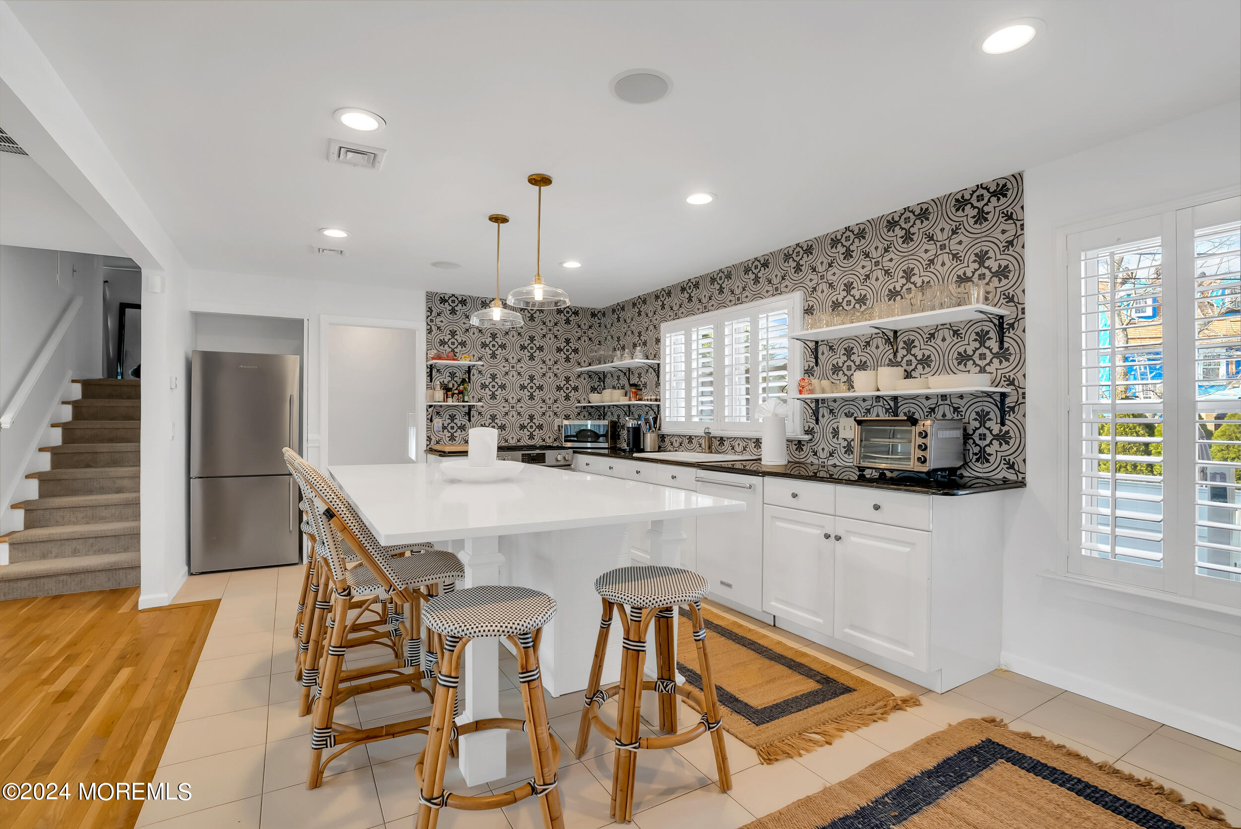 201 Buttermere Avenue Interlaken, NJ 07712 - Photo 10 of 39 a kitchen with stainless steel appliances granite countertop a refrigerator and microwave