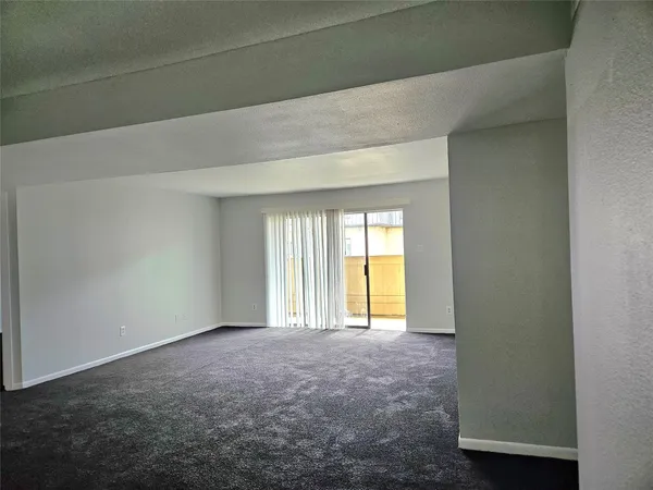 an empty room with a bathroom