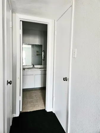 a view of a hallway with stairs