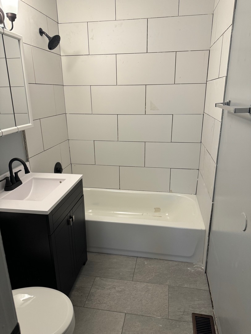 420 Arlington Drive Romeoville, IL 60446 - Photo 11 of 19 a bathroom with a sink toilet and shower