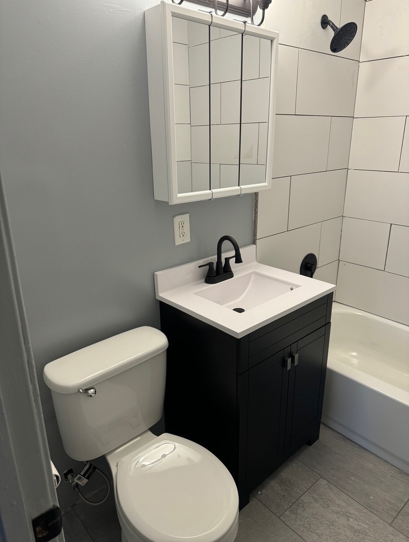 420 Arlington Drive Romeoville, IL 60446 - Photo 12 of 19 a bathroom with a sink vanity and toilet