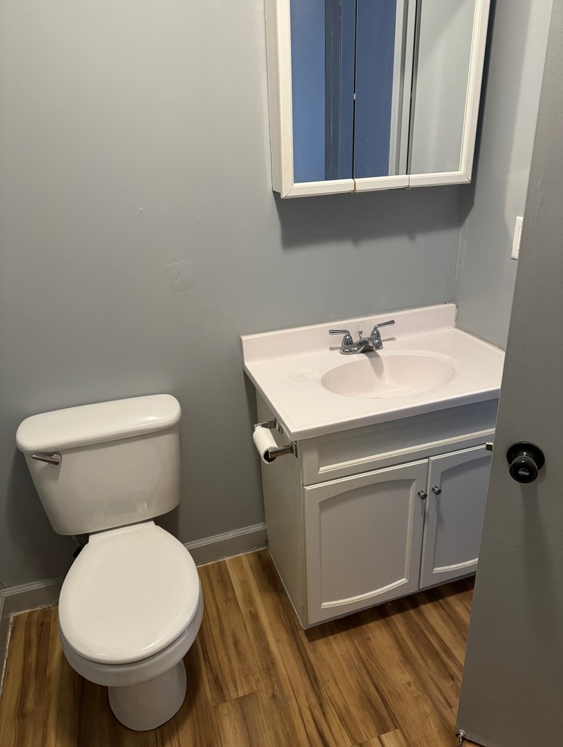 420 Arlington Drive Romeoville, IL 60446 - Photo 14 of 19 a bathroom with a toilet sink and mirror