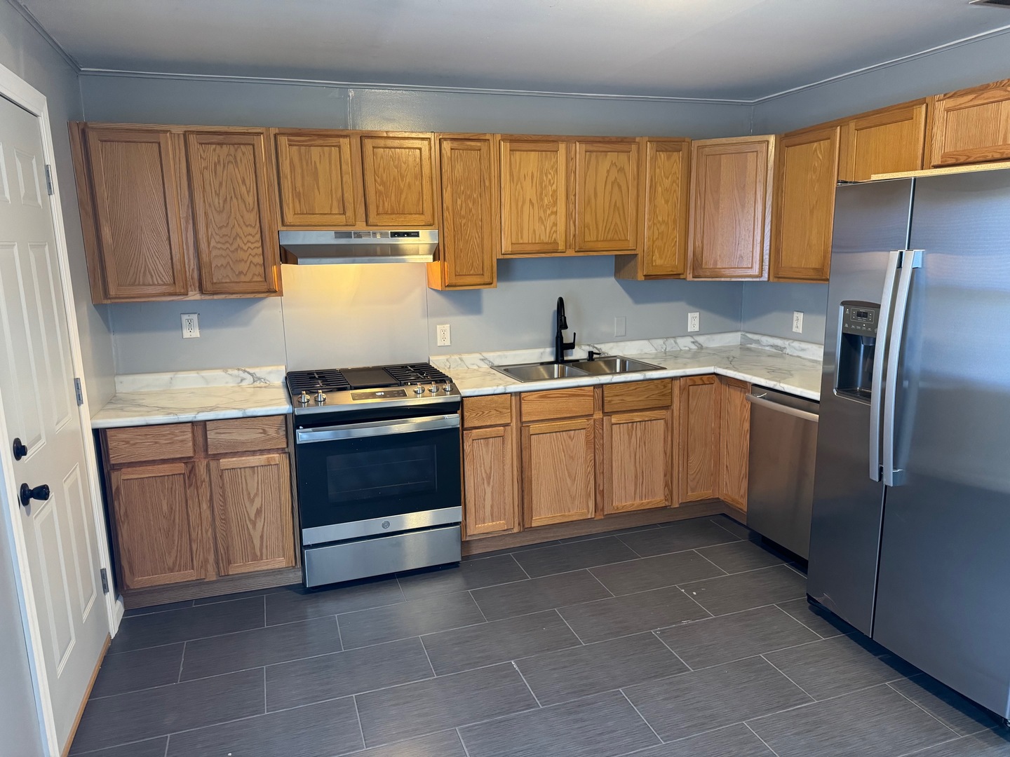420 Arlington Drive Romeoville, IL 60446 - Photo 5 of 19 a kitchen with a stove sink and cabinets