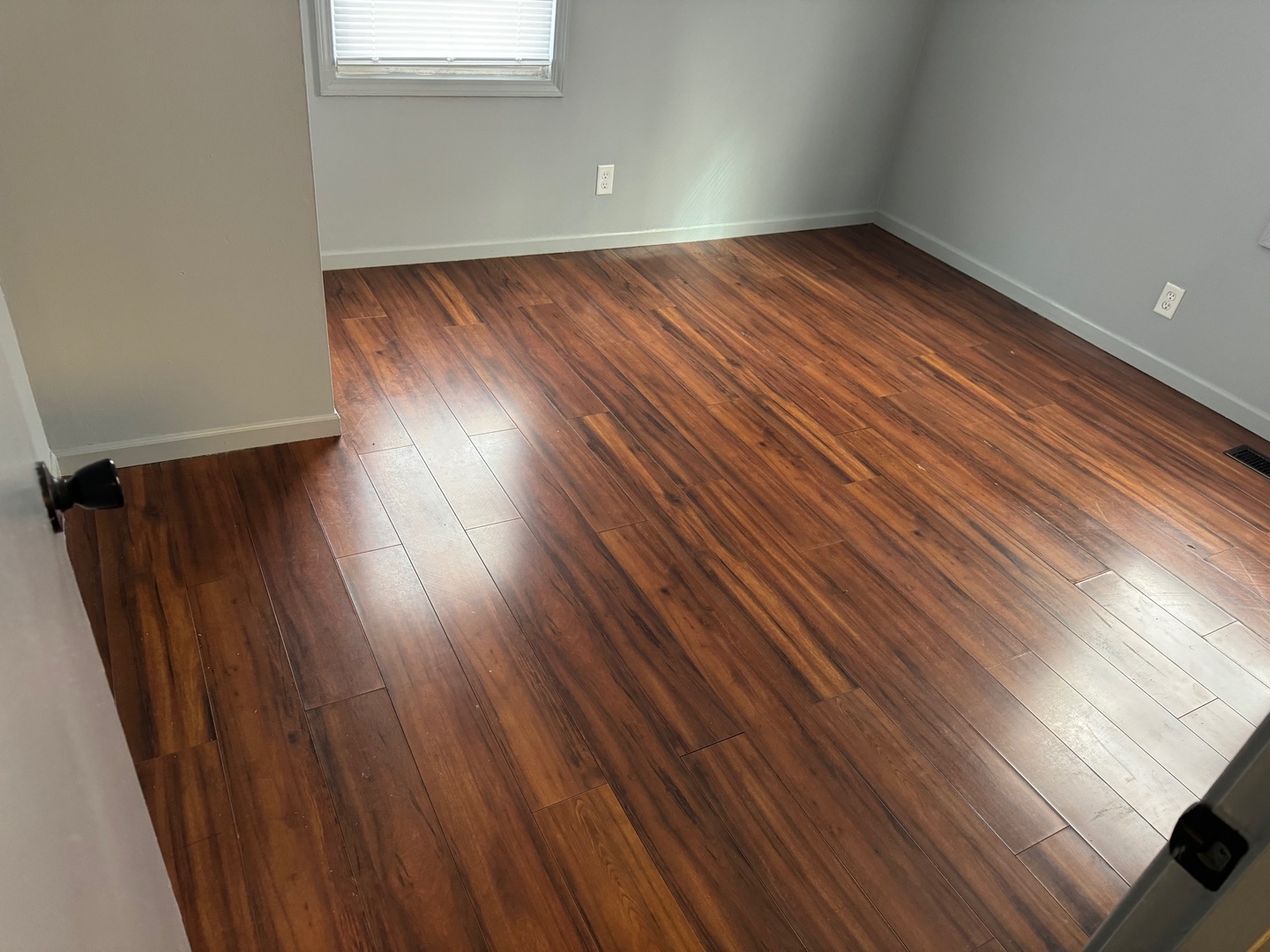 420 Arlington Drive Romeoville, IL 60446 - Photo 10 of 19 a view of an empty room with wooden floor and a window