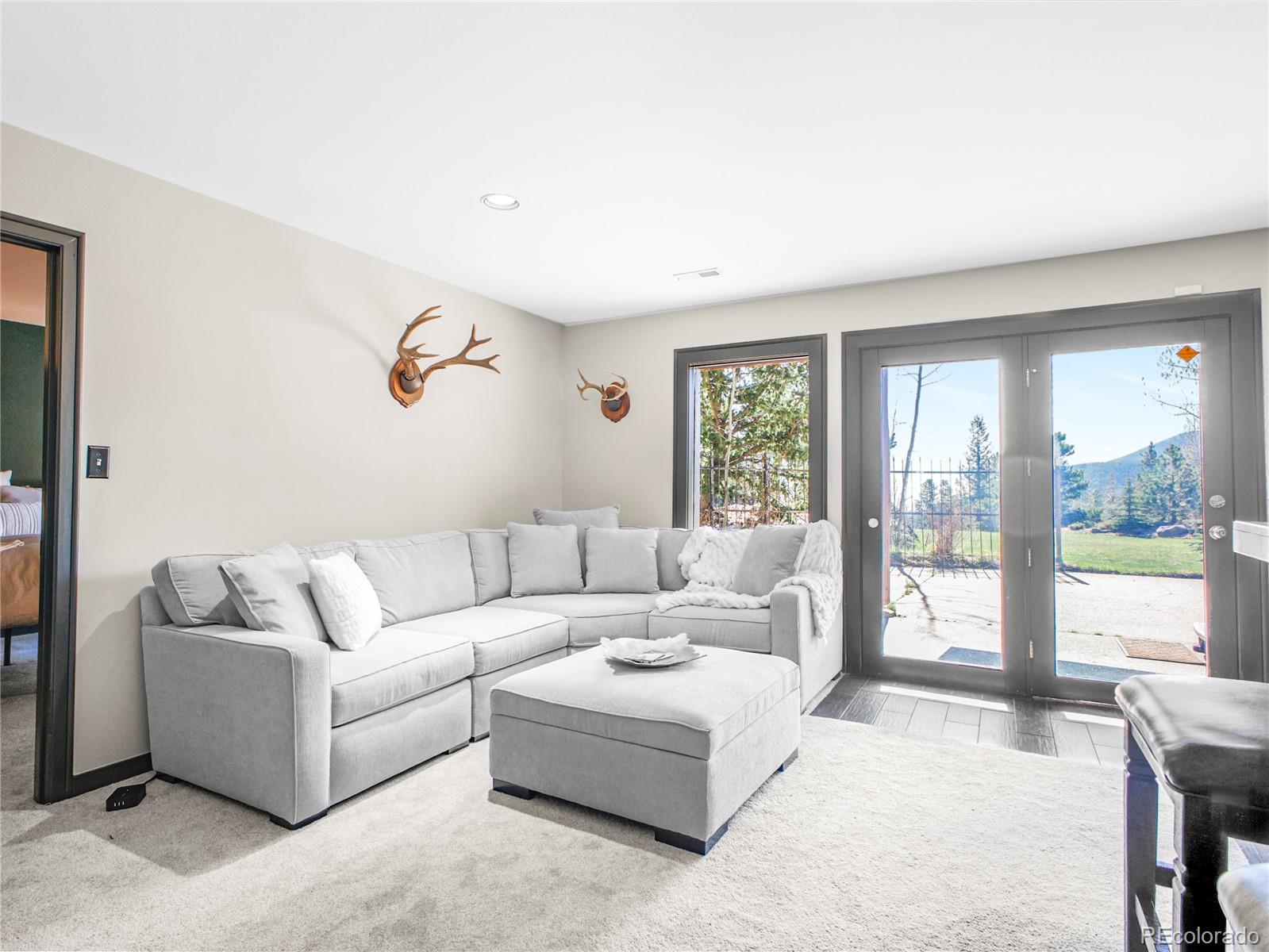 24 Pine Valley Road Evergreen, CO 80439 - Photo 27 of 50 a living room with furniture and a large window