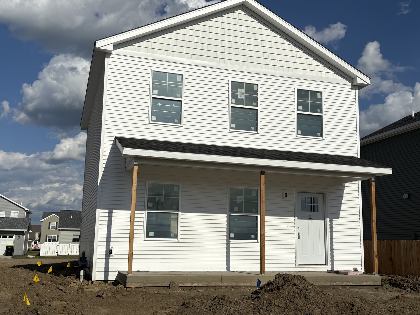 a view of a white house with large windows