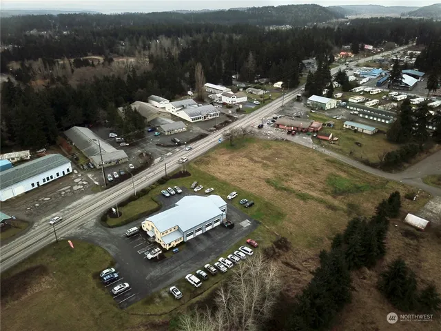 a view of swimming pool with outdoor seating and a shower