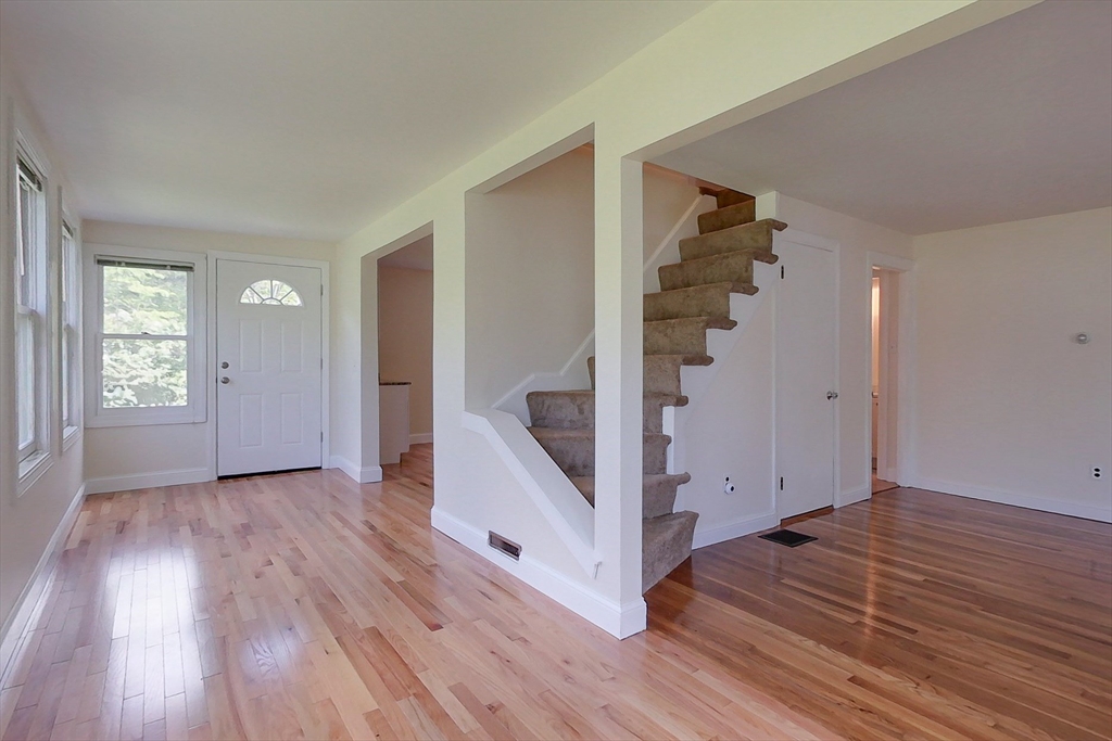 92 Squannacook Road Shirley, MA 01464 - Photo 8 of 38 a view of entryway with wooden floor and stairs