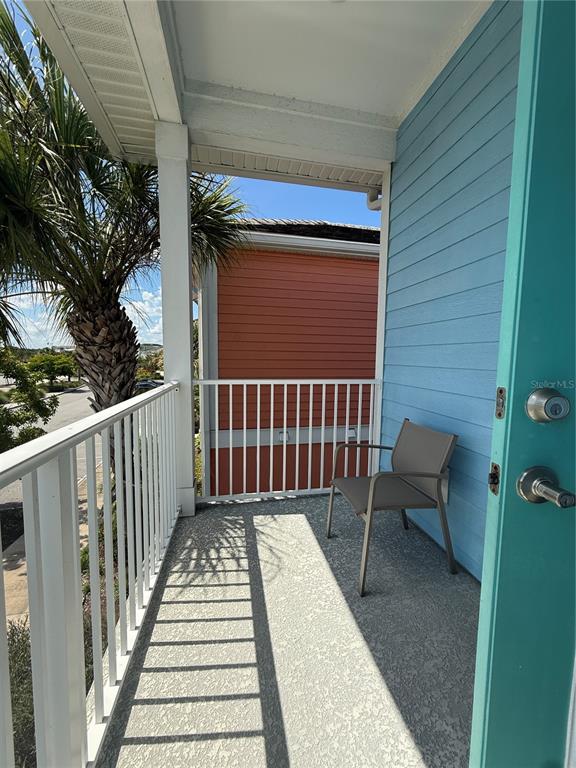 2986 Salted Rim Road Kissimmee, FL 34747 - Photo 13 of 36 a porch with seating space