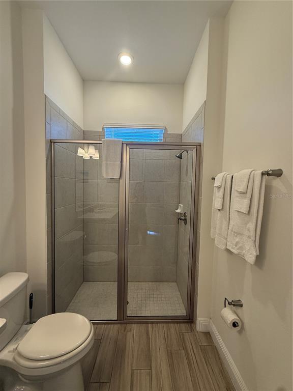 2986 Salted Rim Road Kissimmee, FL 34747 - Photo 24 of 36 a bathroom with a shower a toilet and a sink