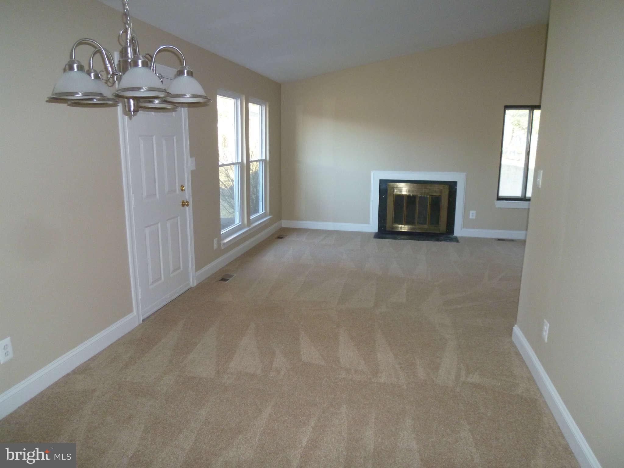 7205 Johnnycake Road Baltimore, MD 21228 - Photo 3 of 14 a view of a livingroom with a fireplace