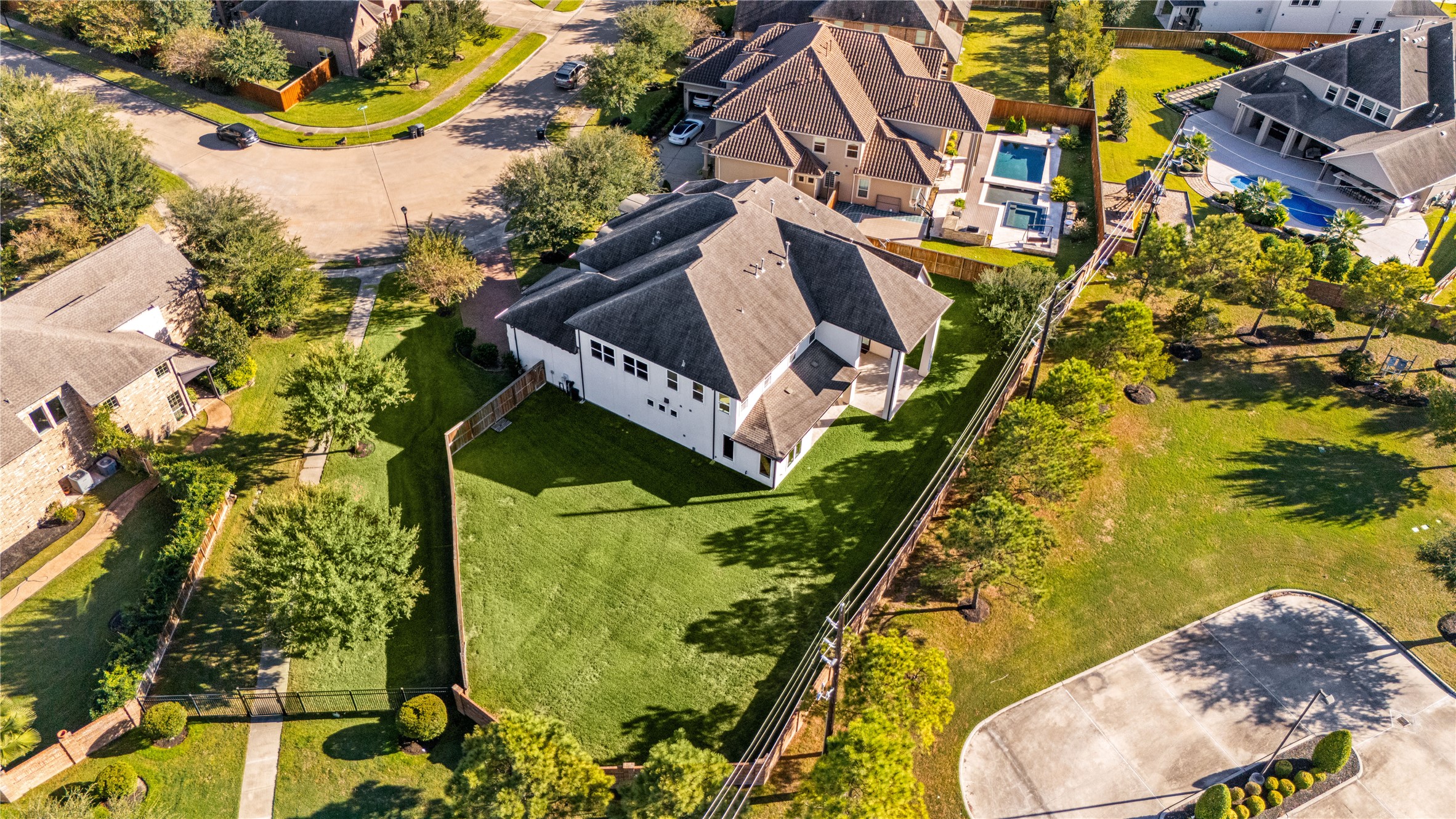 2102 Granite Brook Lane Katy, TX 77494 - Photo 37 of 39 Enjoy the privacy and space this oversized lot has to offer! This aerial view highlights the expansive backyard with plenty of room to create your dream outdoor oasis, perfect for adding a pool, garden, or play area. Located on a quiet cul-de-sac with no back neighbors, this home provides both comfort and seclusion in a beautiful setting.