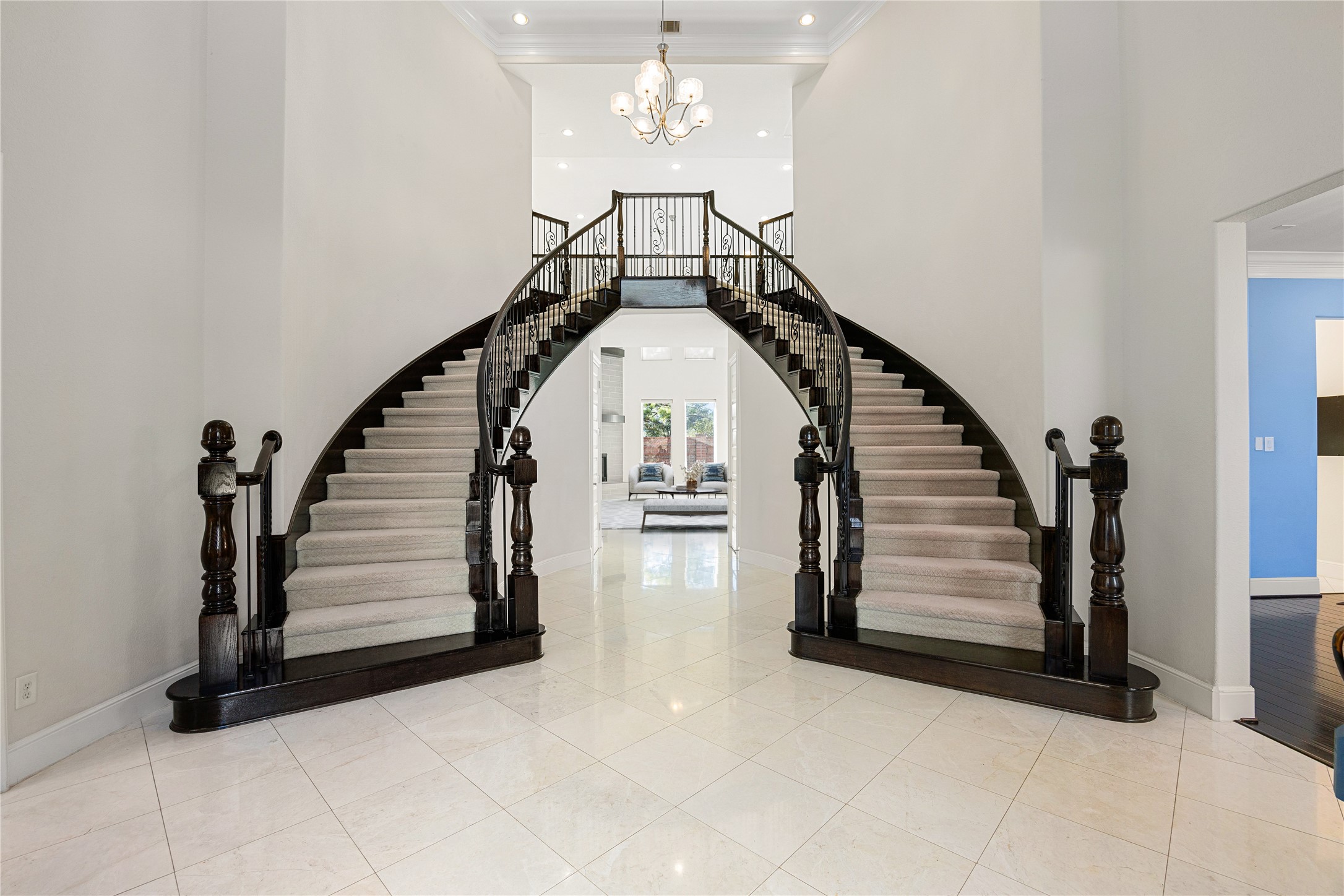2102 Granite Brook Lane Katy, TX 77494 - Photo 4 of 39 A grand dual staircase welcomes you into this stunning entryway, setting the tone for the elegance and sophistication found throughout the home. Soaring ceilings, abundant natural light, and timeless architectural details make this foyer truly unforgettable.