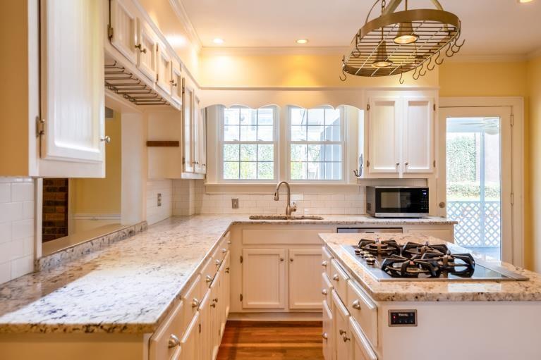 4 Jones Street Cartersville, GA 30120 - Photo 15 of 36 a kitchen with stainless steel appliances granite countertop a stove and a sink