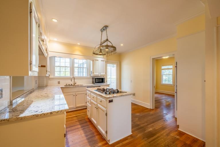 4 Jones Street Cartersville, GA 30120 - Photo 19 of 36 a kitchen that has a lot of cabinets and wooden floor
