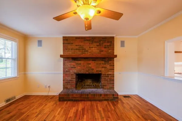 a view of a room with window and wooden floor