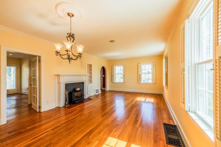 4 Jones Street Cartersville, GA 30120 - Photo 10 of 36 a view of empty room with wooden floor and fireplace