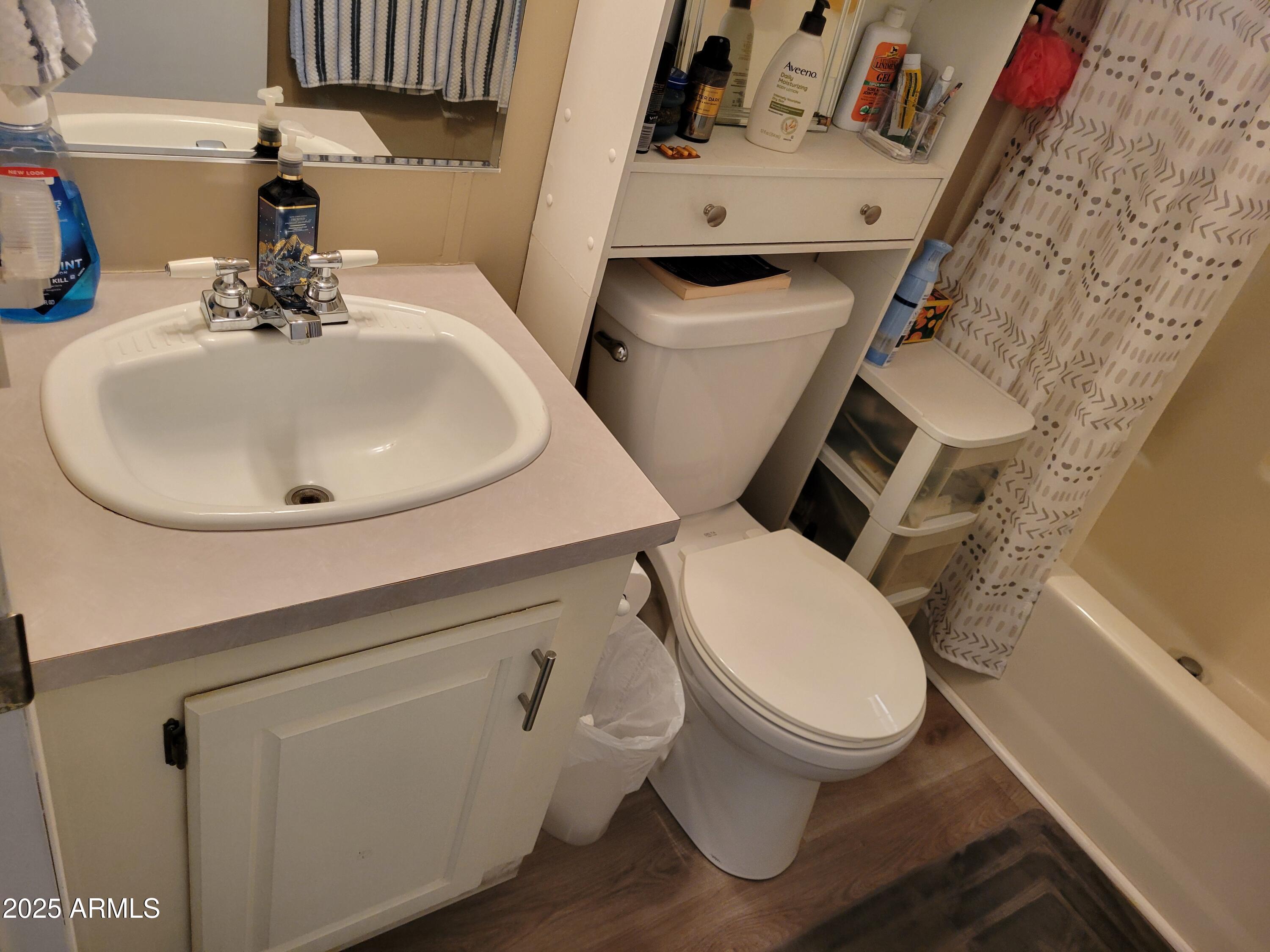2460 East Main Street, Unit B9 Mesa, AZ 85213 - Photo 11 of 15 a bathroom with a toilet sink and mirror