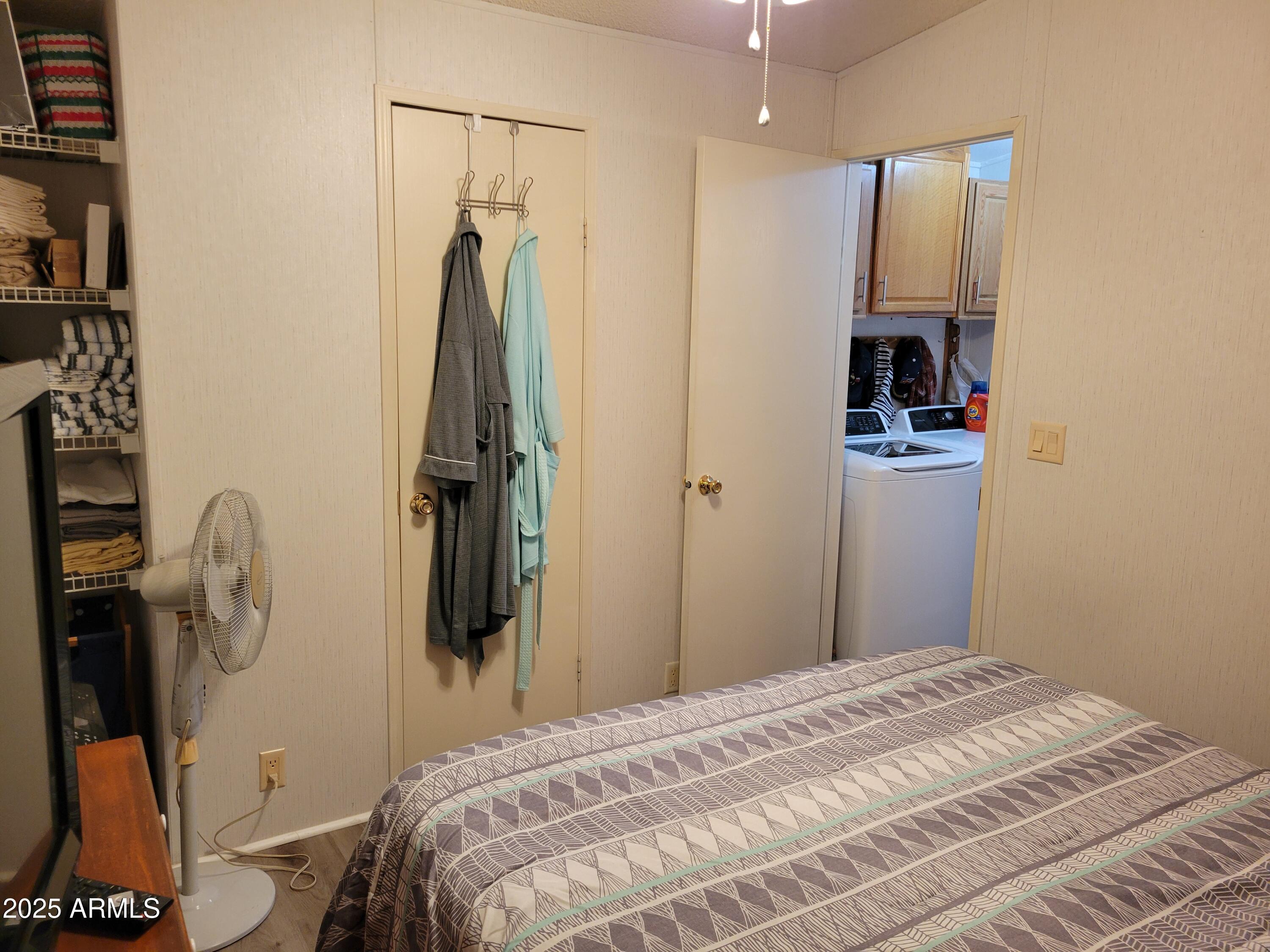 2460 East Main Street, Unit B9 Mesa, AZ 85213 - Photo 13 of 15 a bedroom with a bed and a mirror