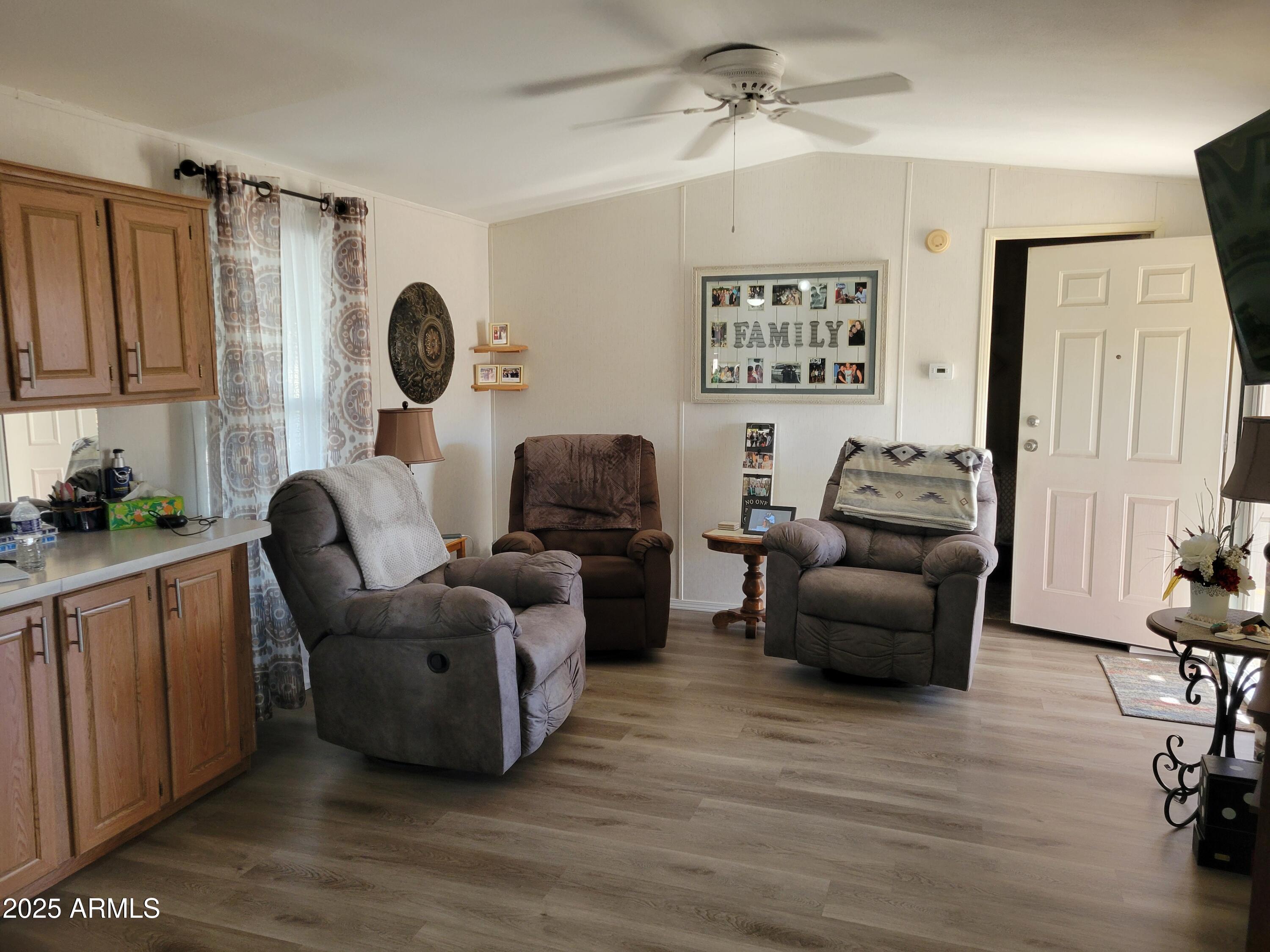 2460 East Main Street, Unit B9 Mesa, AZ 85213 - Photo 4 of 15 a living room with furniture and a large window