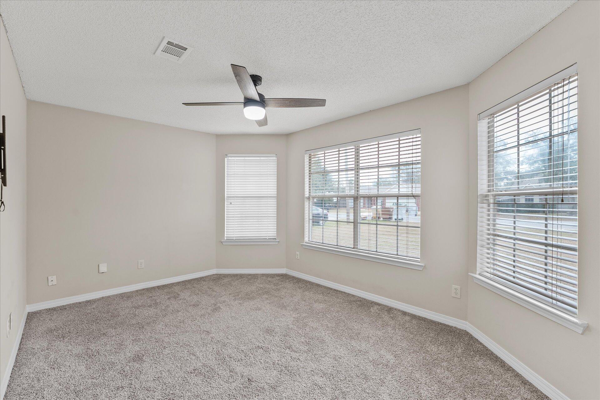 2723 Rambler Court Navarre, FL 32566 - Photo 18 of 40 a view of an empty room with a window