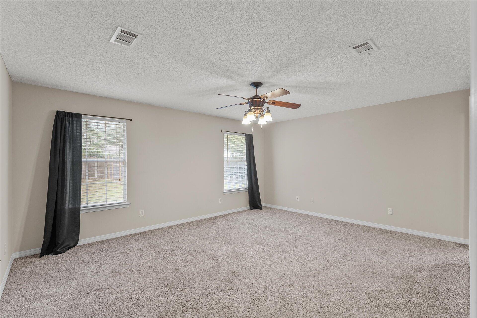 2723 Rambler Court Navarre, FL 32566 - Photo 20 of 40 a view of an empty room with a window