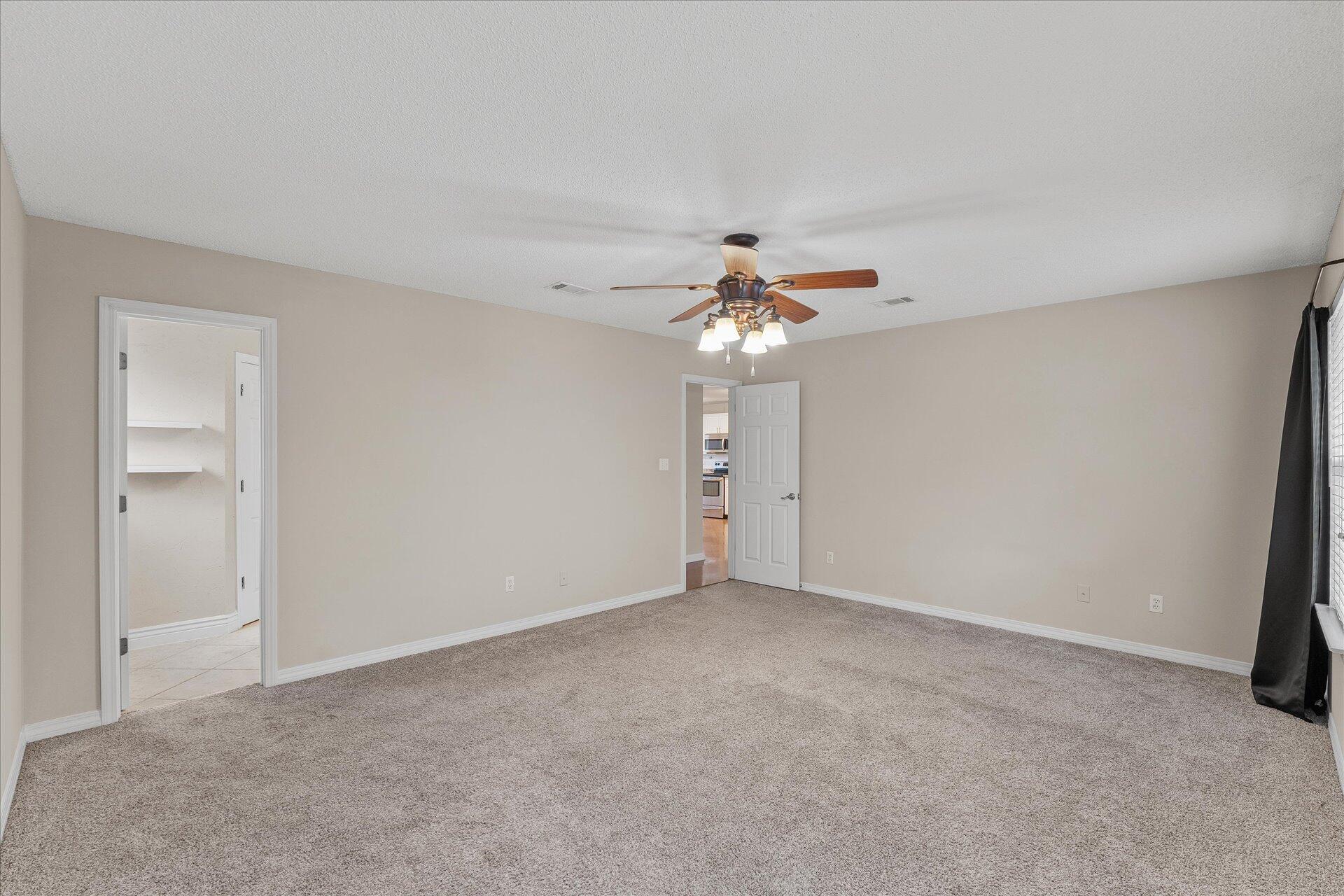 2723 Rambler Court Navarre, FL 32566 - Photo 21 of 40 a view of an empty room with a fan