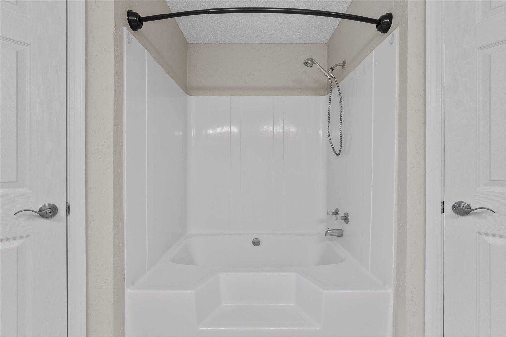 2723 Rambler Court Navarre, FL 32566 - Photo 24 of 40 a bathroom with a bathtub