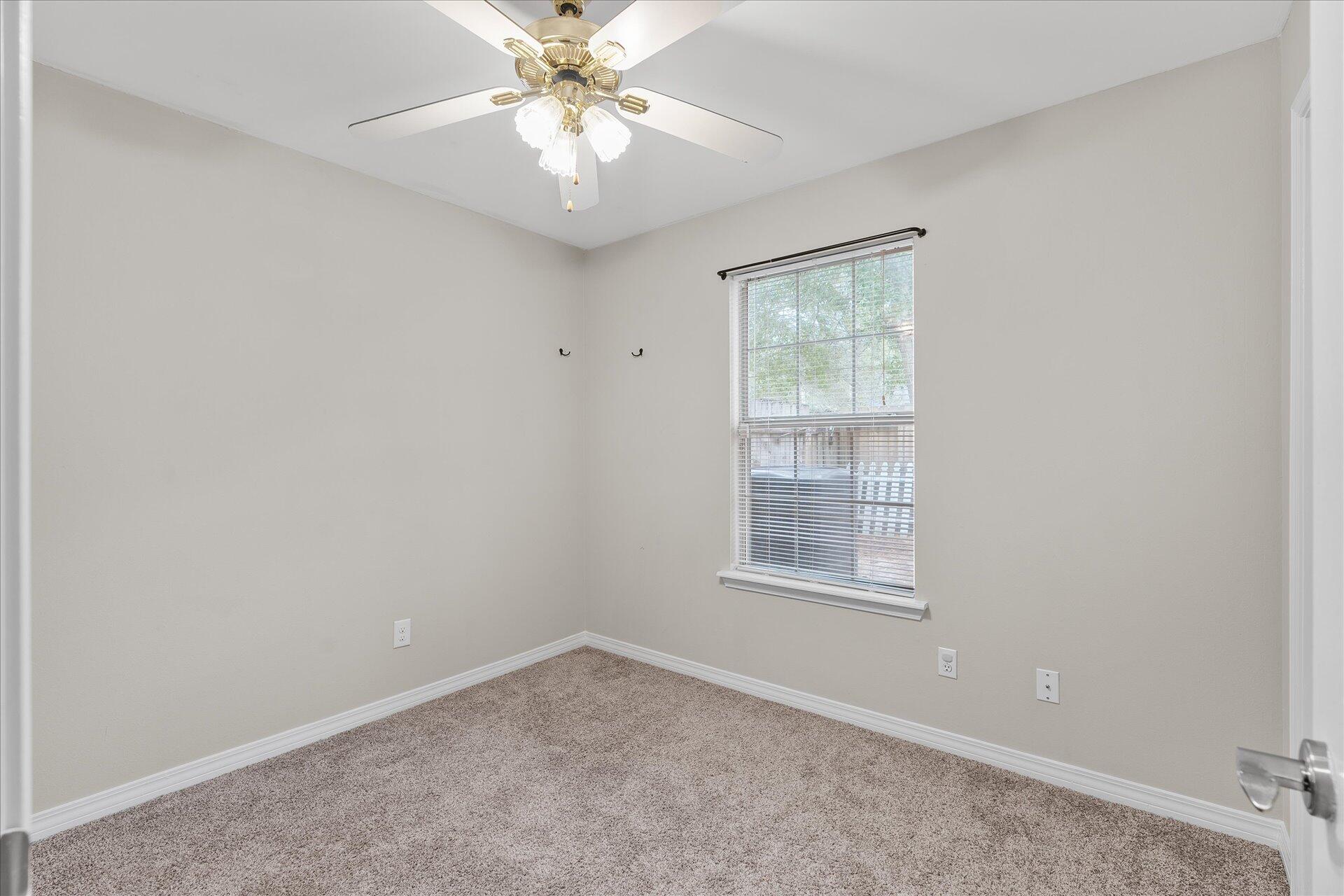 2723 Rambler Court Navarre, FL 32566 - Photo 28 of 40 an empty room with a window