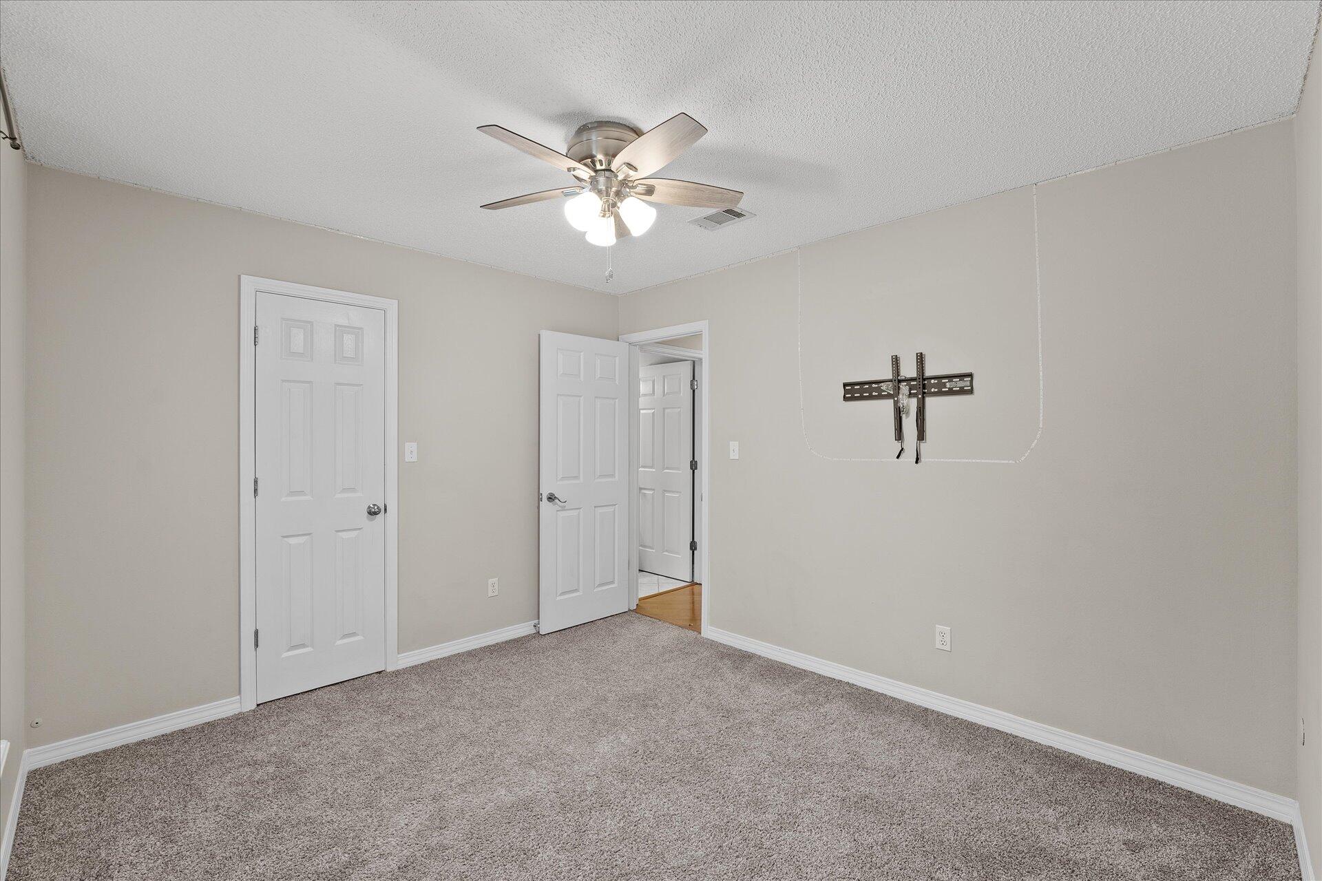 2723 Rambler Court Navarre, FL 32566 - Photo 31 of 40 a view of an empty room with a fan