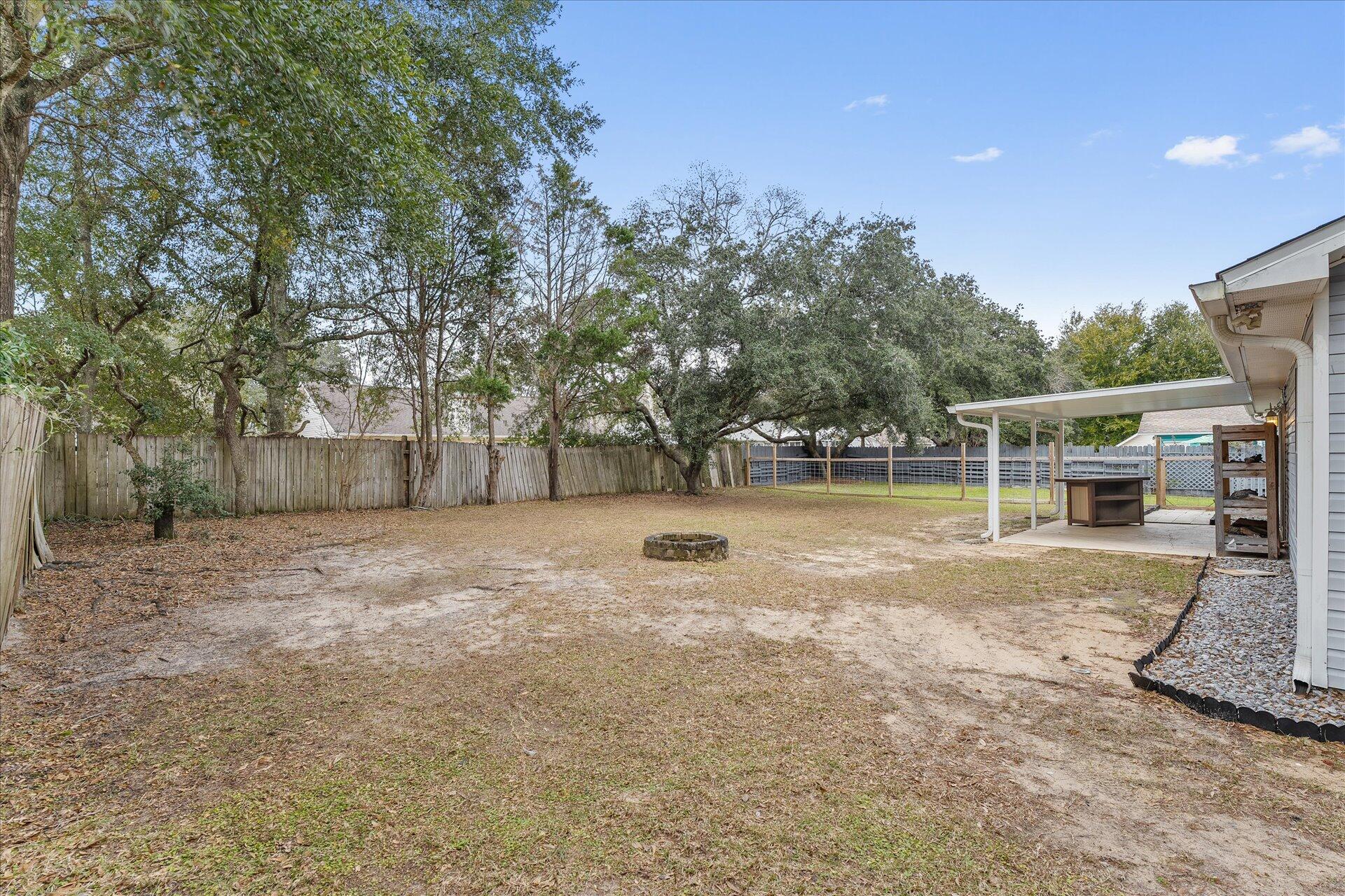 2723 Rambler Court Navarre, FL 32566 - Photo 37 of 40 a view of backyard with green space
