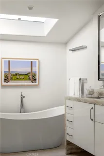 a bathroom with a bathtub and sink