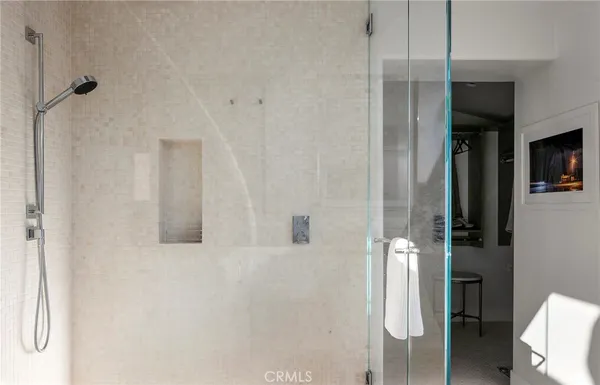 a bathroom with a shower and a toilet