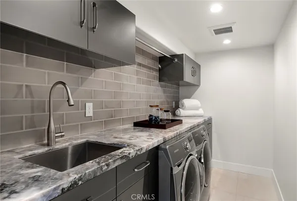 a kitchen with a sink and cabinets
