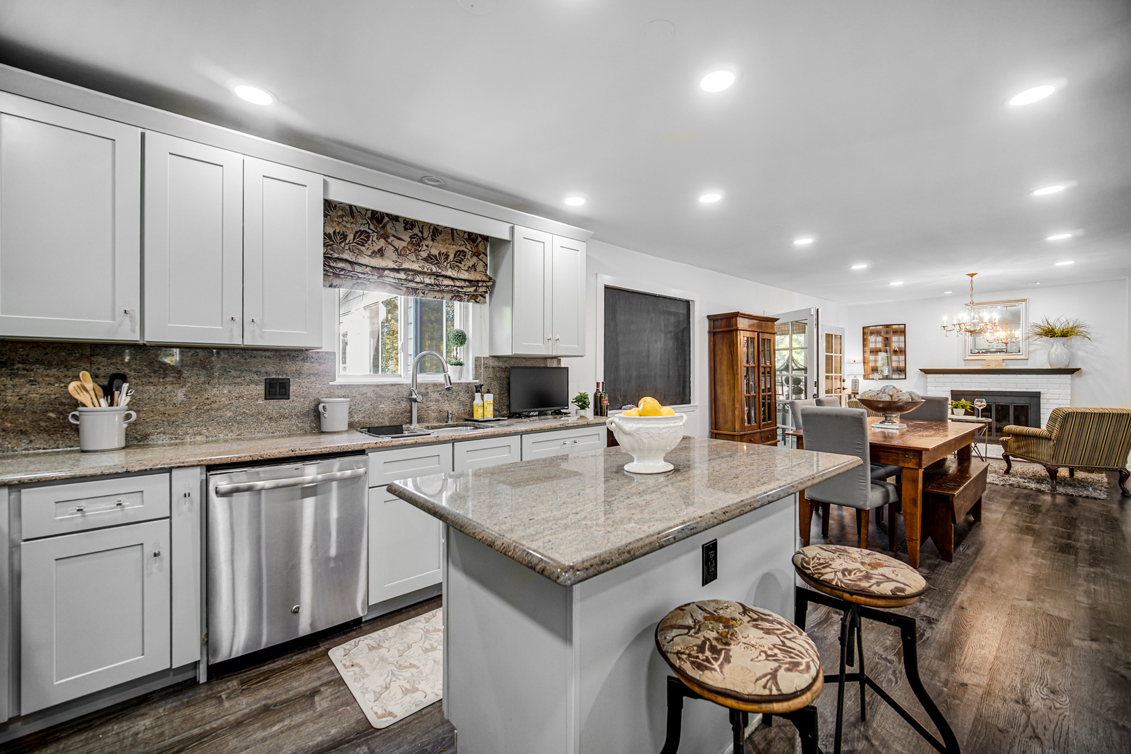 9209 Jasmine Way Fox River Grove, IL 60021 - Photo 13 of 37 a kitchen with a table chairs sink and cabinets
