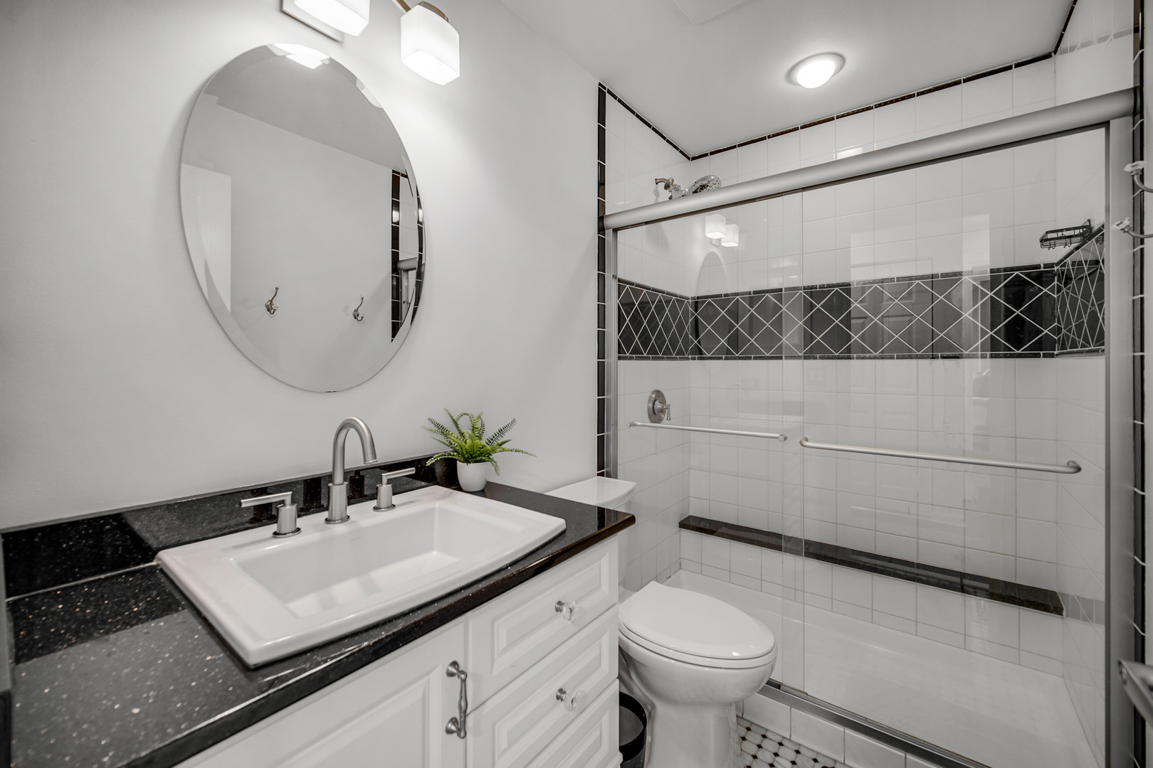 9209 Jasmine Way Fox River Grove, IL 60021 - Photo 15 of 37 a bathroom with a sink a toilet and a mirror