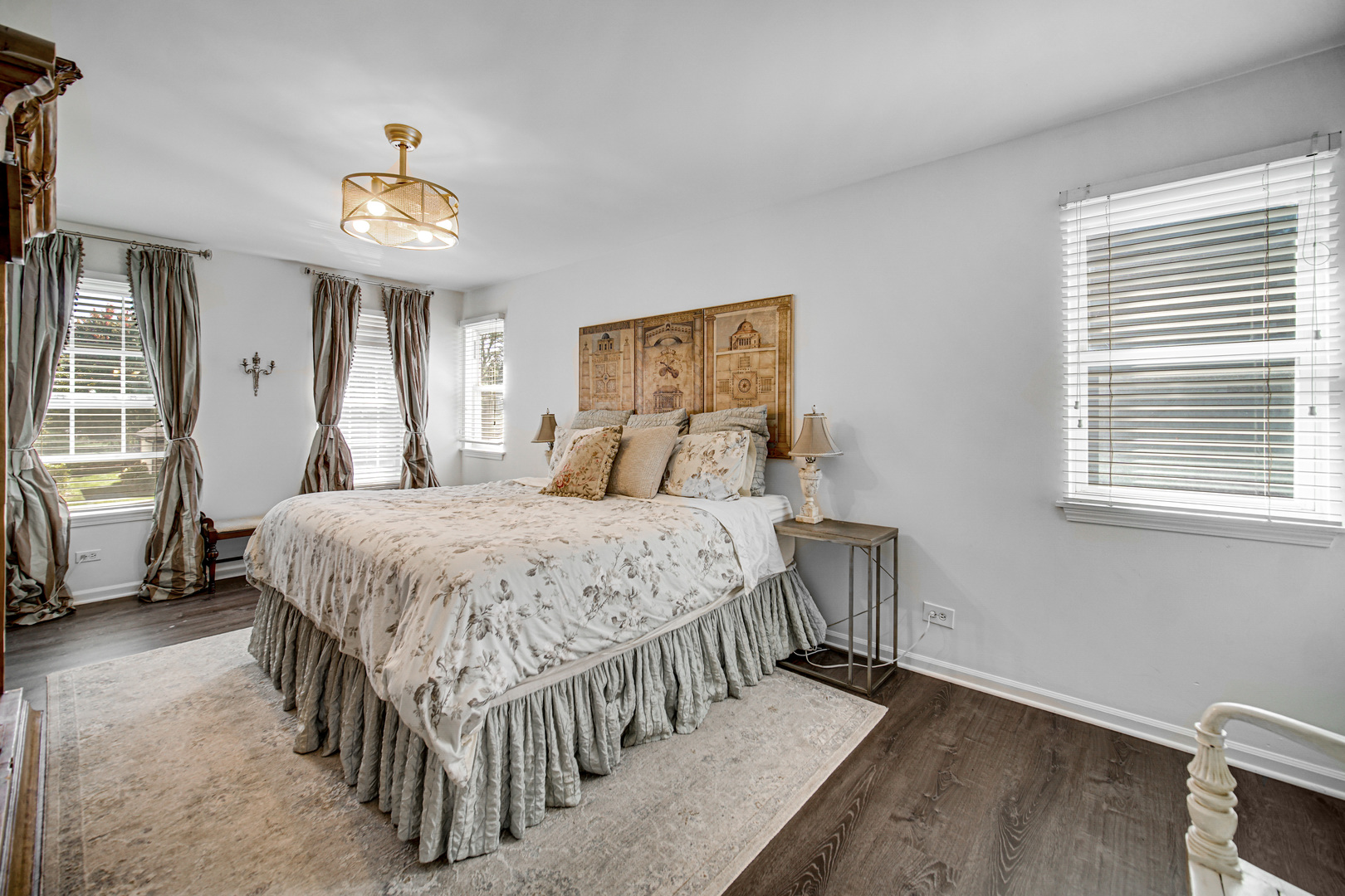 9209 Jasmine Way Fox River Grove, IL 60021 - Photo 21 of 37 a bedroom with a bed and a chandelier