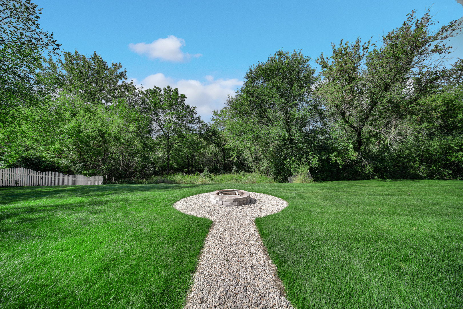 9209 Jasmine Way Fox River Grove, IL 60021 - Photo 37 of 37 a view of a garden with large trees