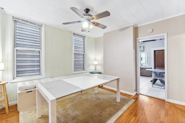 a view of a livingroom with a chandelier fan